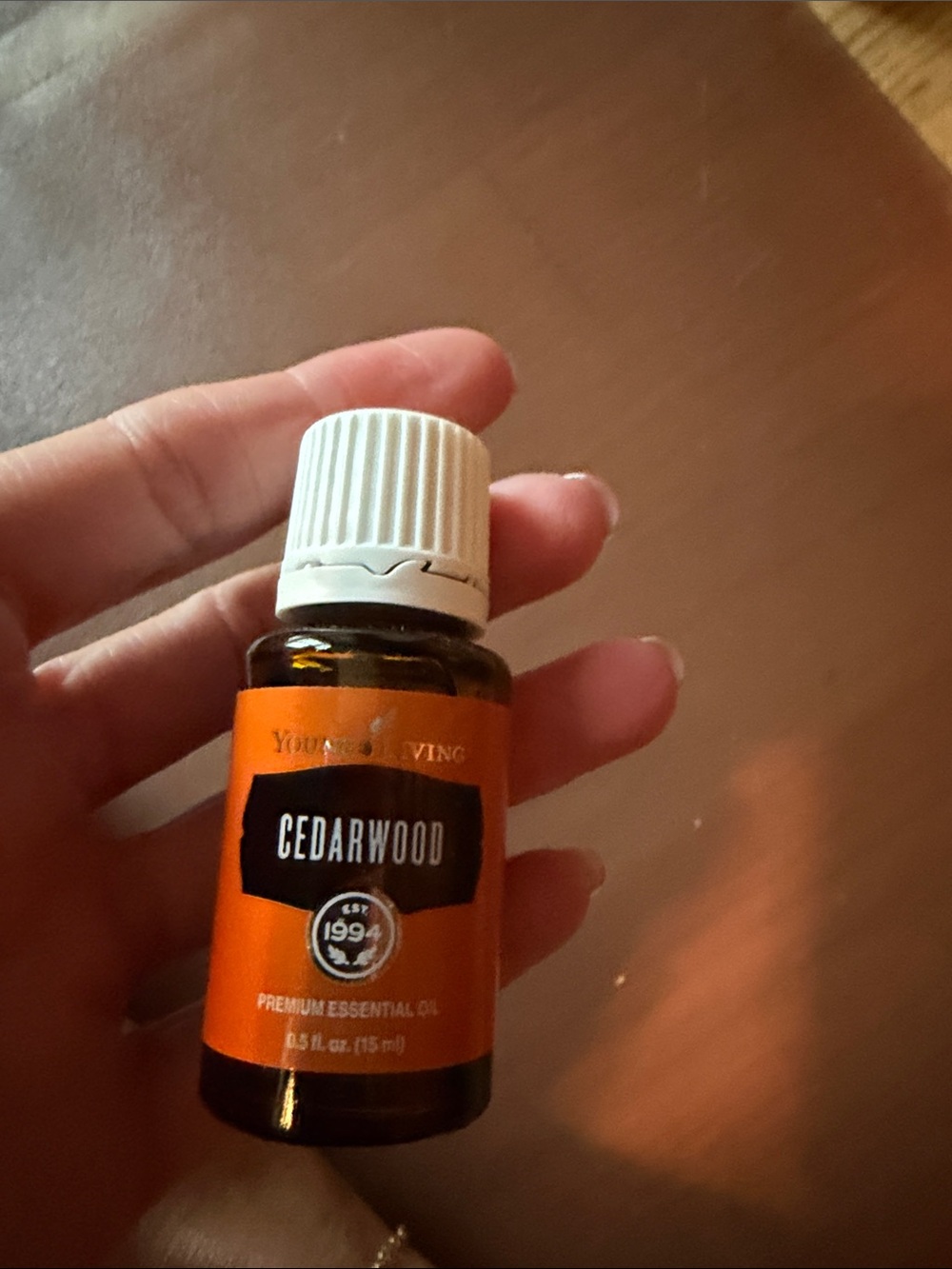 Young Living Cedarwood Essential Oil - Orange and White